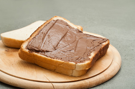 bread and chocolate on wooden background