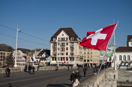 BASEL - Switzerland - 11 February 2015 - Mittlere Br?cke Bridge with Switzerland flagのeditorial素材