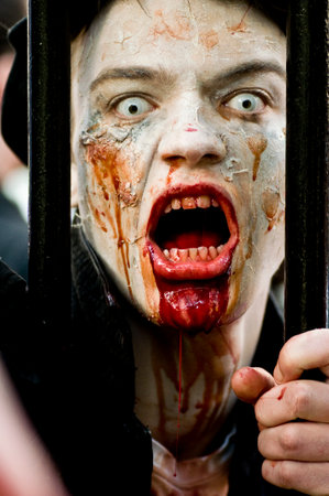 Paris, France - November 16, 2010: People dressed as a zombie parades on a street during a zombie walk in Paris.のeditorial素材