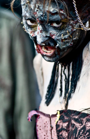 Paris, France - November 16, 2010: People dressed as a zombie parades on a street during a zombie walk in Paris.のeditorial素材
