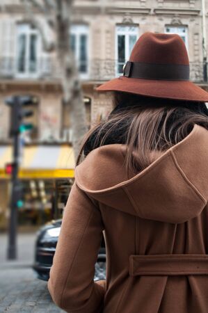 woman with hat in the street