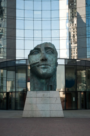 PARIS - France - 23 March 2015 - La defense - Tindaro statue by Igor Mitoraj with Buildingsのeditorial素材