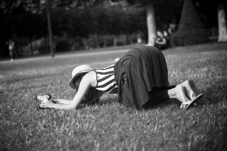 PARIS - France - 11 July 2012 - asian tourist take a picture at champ de Mars in Eiffel Towerのeditorial素材