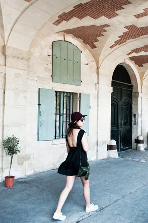 PARIS  France  20 July 2013  woman with dress and hat walking in Vosges place in parisのeditorial素材