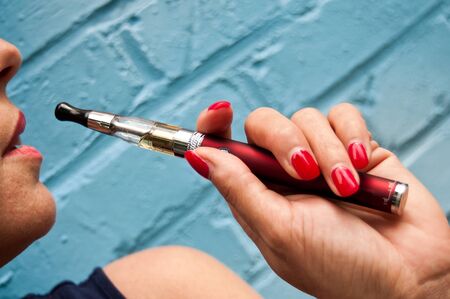 closeup woman with ecigarette