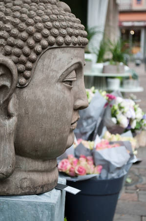 stoned buddha statue in outdoorの写真素材