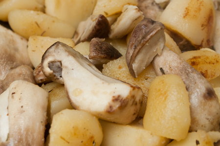 boletus edulis mushrooms and potatoes cookingの写真素材