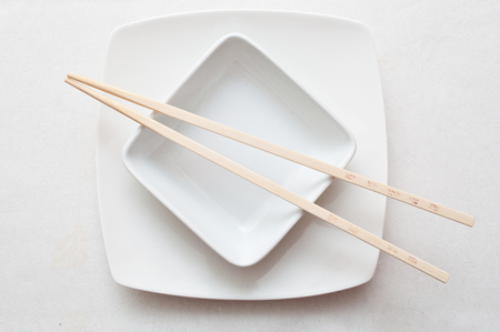 chinese bowl and chinese chopsticks on white backgroundの写真素材