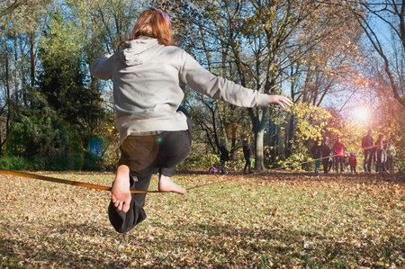 MULHOUSE - France - 11 November 2015 - tightrope walker between two trees