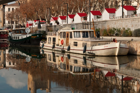 Narbonne - France - 23 december 2015 - quay with touristic boatsのeditorial素材