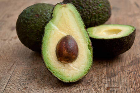 closeup of avocado on wooden background