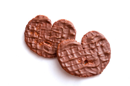 chocolate biscuit heart shape on white backgroundの写真素材