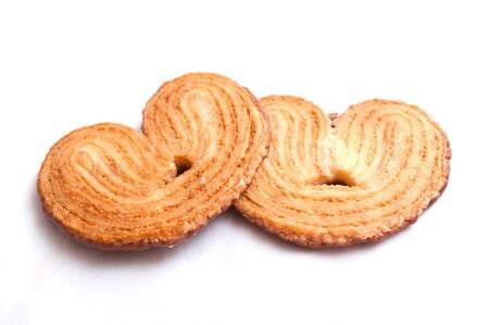 chocolate biscuit heart shape on white backgroundの写真素材