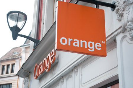MULHOUSE - France 19 May 2016 - retail of the logo of the brand "Orange" the phone operator signageのeditorial素材