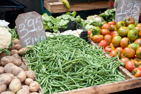 fresh green beans and various vegetables at the market in outdoorの写真素材