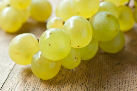 closeup of White  grapes on wooden backgroundの写真素材