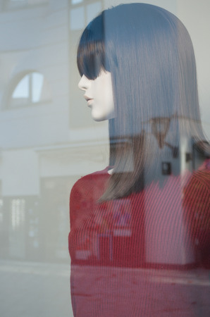 mannequin with red pullover in a women fashion shopping storeの写真素材