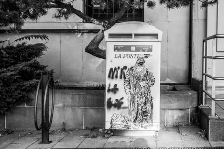 MULHOUSE - France - 3 November 2016 - graffiti of poor man on mailbox by the painter artist C215 in Mulhouse.のeditorial素材