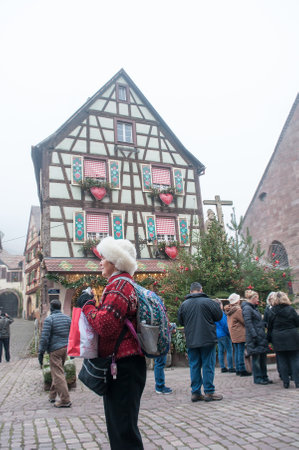KAYSERSBERG - France - 15 December 2016 - tourists in the Street of the the typical alsatian villageのeditorial素材