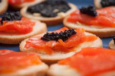 closeup of Lump fish roe and  salmon appetizers in a plateの写真素材