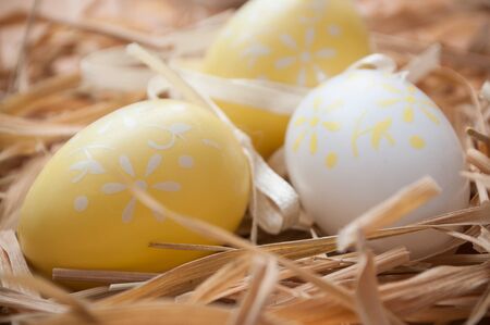closeup of decorative easter eggs In a nest