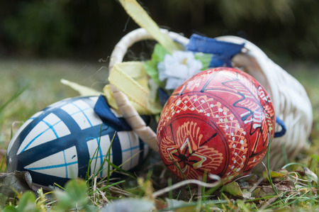 closeup of decorative easter eggs in outdoor in the grassの写真素材