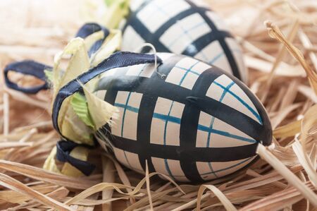 closeup of decorative easter eggs in a nest