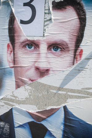 MULHOUSE - France - torn poster of Emmanuel Macron the finalist candidate for tre presidential electionのeditorial素材