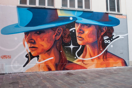 MULHOUSE - France - 27 April 2017 - graffiti of women with hat by the artist Douroneのeditorial素材