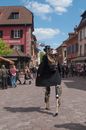 KAYSERSBERG - France - 29 April 2017 - man on stilts at the steam punk exhibition in Kaysersberg villageのeditorial素材