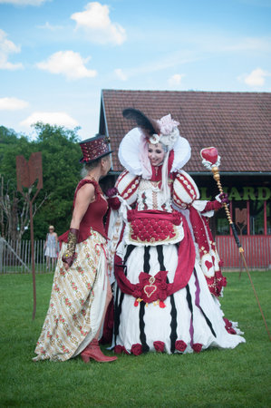 WESSERLING - France - 21 May 2017 - women with red dress steampunk and manga style  in park way at cosplay exhibition eventのeditorial素材