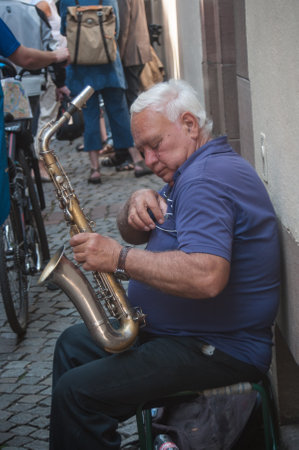 STRASBOURG - France - 25 May 2017 - Saxophonist in the street  in Strasbourgのeditorial素材
