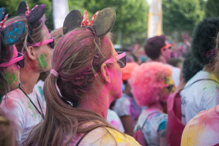 MULHOUSE - France - 4 June 2017 - portrait of girls with Mickey ears at Colore Mulhouse 2017, the annual running of five kilometers with colored powder jetsのeditorial素材