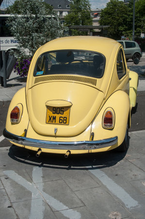 MULHOUSE - France - 18 June 2017 - old Volkswagen yellow beetle parked in the streetのeditorial素材