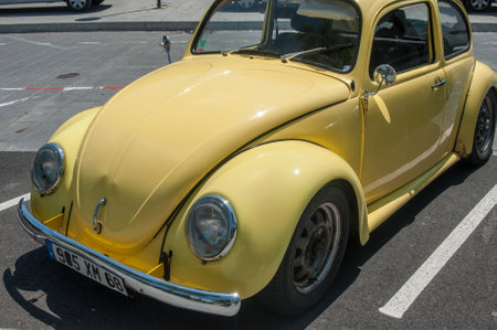MULHOUSE - France - 18 June 2017 - old Volkswagen yellow beetle parked in the streetのeditorial素材