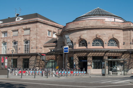 MULHOUSE - France - 20 June 2017 - Train station facade with city bike vacationのeditorial素材