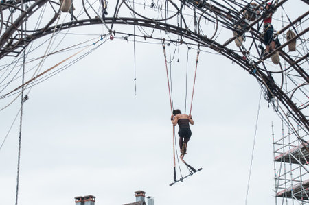 MULHOUSE - France - 11 July 2017 - Portrait of a young woman training on trapeze for an outdoor aerobatics show in the main place of Mulhouseのeditorial素材