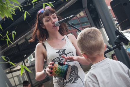 MULHOUSE - France - 17 July 2017 - Violette Deadwood with child from public at tightrope walker show with Johanne Humbletのeditorial素材