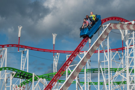 MULHOUSE - France - 25 July 2017 - roller coaster with shouting people in attraction park in Mulhouseのeditorial素材