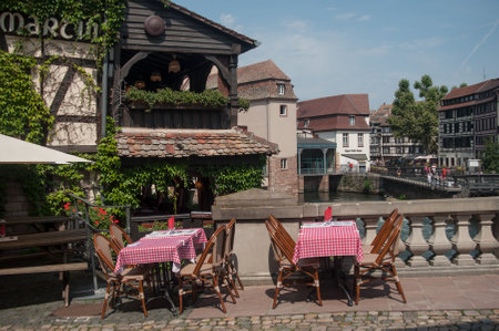 STRASBOURG - France - 1 August 2017 - traditional architecture and restaurant terrace  at little France quarter in Strasbourgのeditorial素材