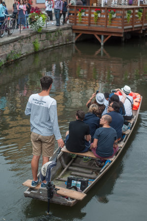 COLMAR - France - 9 August 2017- Boat trip tourism on water at little Venise quarterのeditorial素材