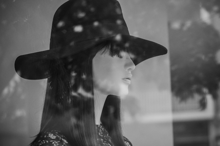 closeup of mannequin with hat in fashion store for womenの写真素材