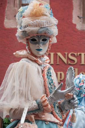 RIQUEWIHR - France - 1 July 2017 - portrait of Costumed woman with blue dress and fan at the Venetian Parade in Riquewihr in Alsaceのeditorial素材