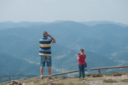 Le grand Ballon, France - 27 August 2017 - tourists taking picture with panorama backgroundのeditorial素材