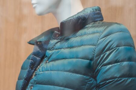 closeup of bue moncler on mannequin  in fashion store showroom for womenの写真素材
