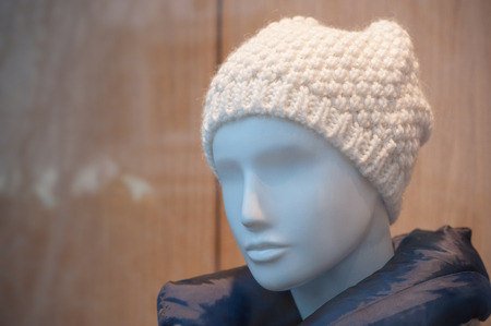 portrait of mannequin with wool hat in fashion store showroom for womenの写真素材
