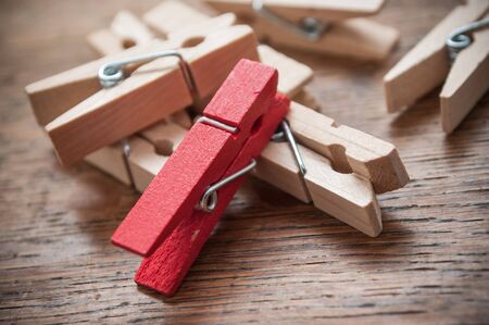 closeup of wooden clothes pin on wooden table backgroundの写真素材