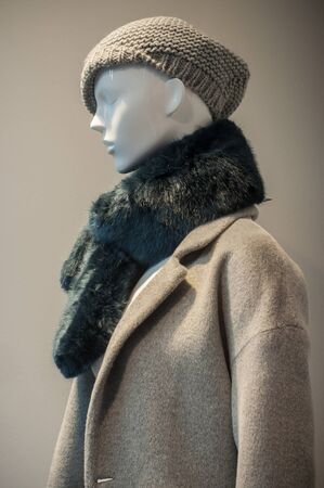 closeup of mannequin with winter clothes in fashion store showroom for womenの写真素材