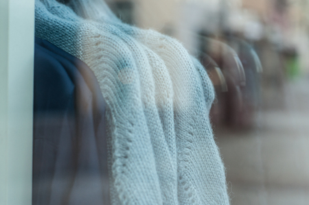 closeup of wool pullover in fashion store showroom for womenの写真素材
