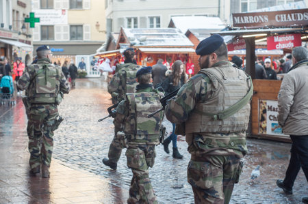 Mulhouse - France - 9 December 2017  - group of military patrolling with machines gun in christmas marketのeditorial素材